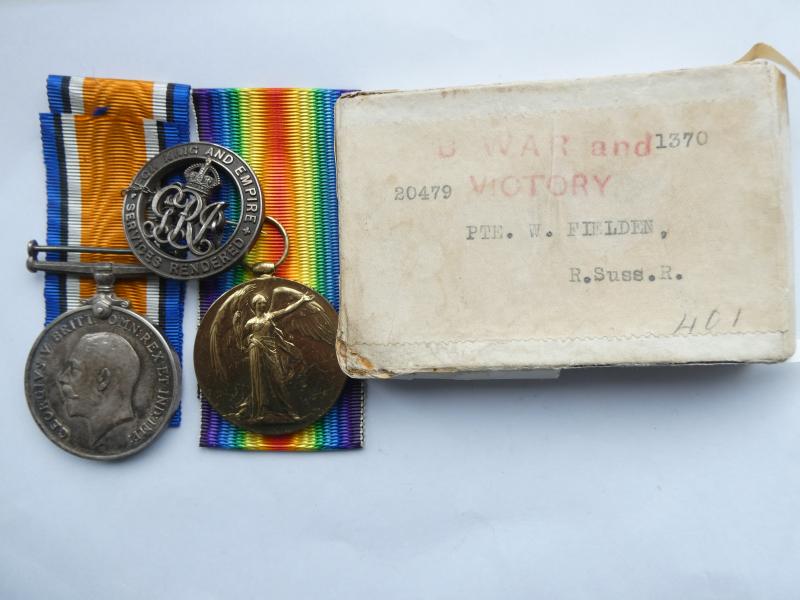 BRITISH WAR AND VICTORY MEDALS-AND SILVER DISCHARGE BADGE- TO FIELDEN ROYAL SUSSEX REGT