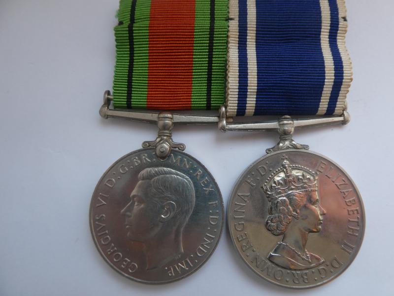 DEFENCE MEDAL AND POLICE EXEMPLARY SERVICE MEDAL TO CONSTABLE ARTHUR MITCHELL