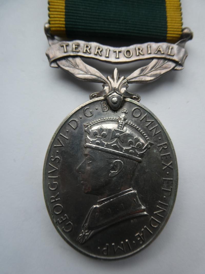 TERRITORIAL EFFICIENCY MEDAL TO CPL C.E.JONES-A.T.S