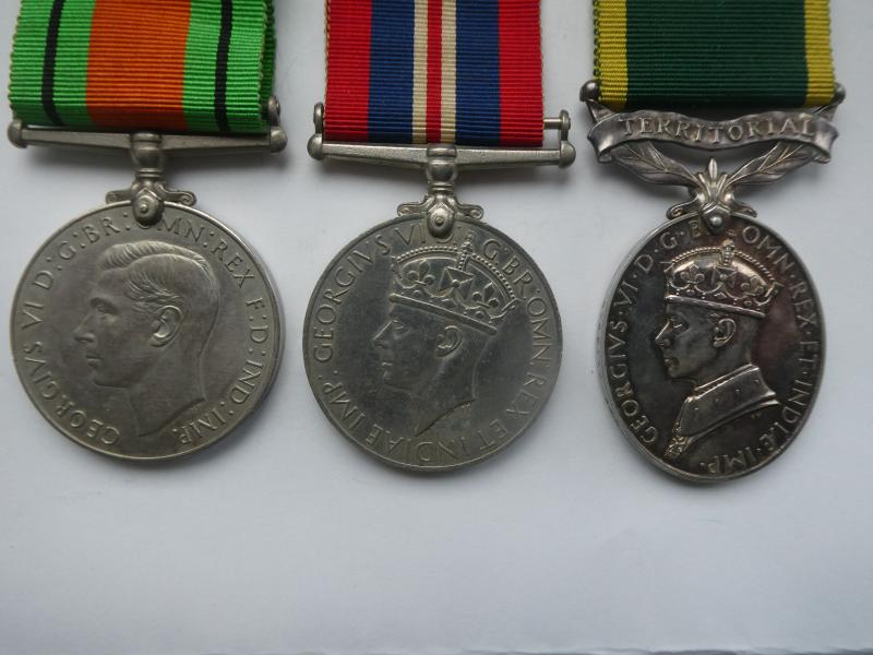 TERRITORIAL EFFICIENCY MEDAL GROUP OF THREE TO BANDSMAN FIDDIMAN 7TH BTN NORFOLK REGT