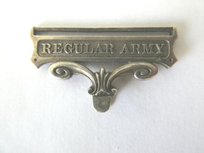 AN ORIGINAL REGULAR ARMY CLASP AND SUSPENSION FOR THE ARMY LONG SERVCE AND GOOD CONDUCT MEDAL
